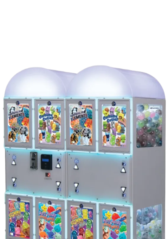Four capsule toy vending machines with brightly colored animal and gummy toy advertisements, filled with plastic balls.