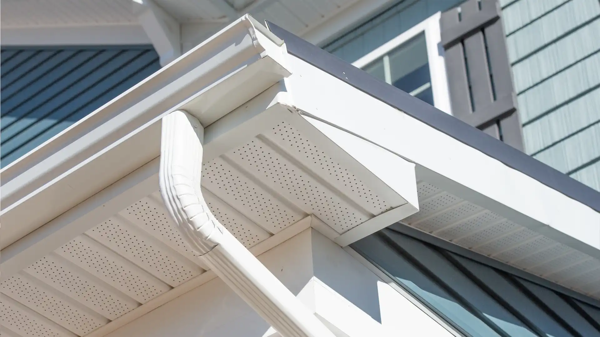 White gutter and soffit detail on a home’s roof overhang.
