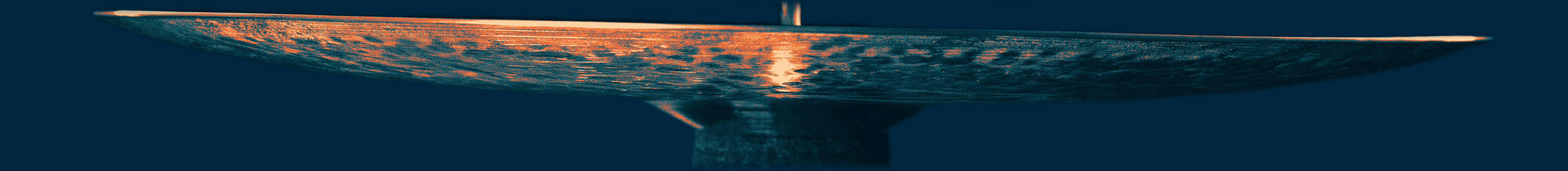 Close-up of a hi-hat cymbal with a blurred motion effect against an orange background.