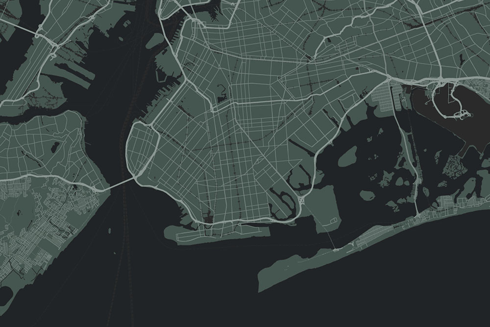 Dark-themed map showing detailed street and waterway layout of a coastal urban area.