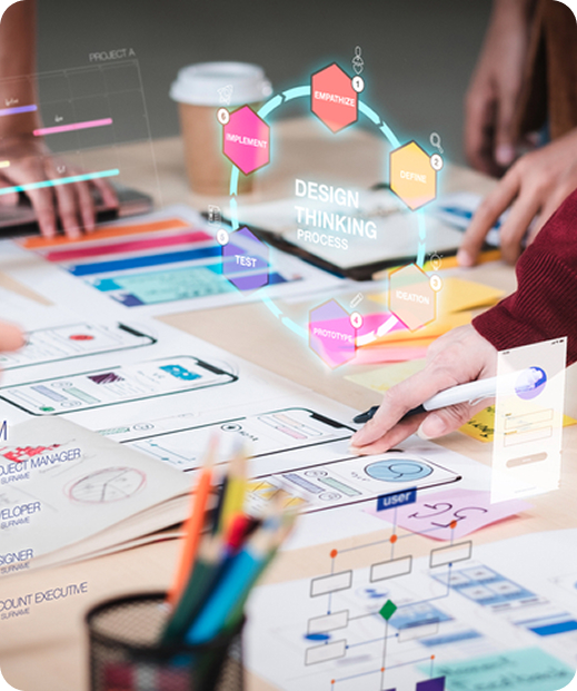 Hands working on UX/UI design wireframes and prototypes with colorful sticky notes, sketches and design materials across desk