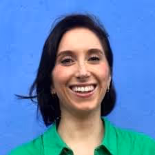 A smiling woman with black hair