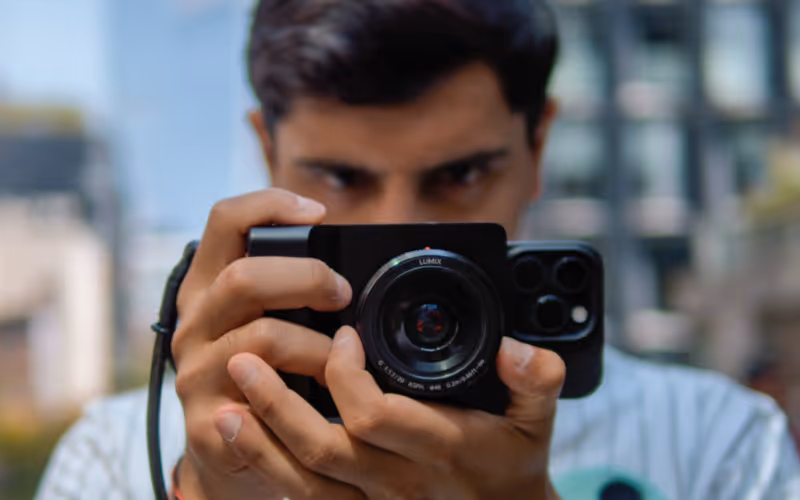 A man pointing a camera forwards