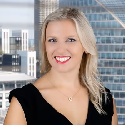 Blonde woman smiling towards the camera