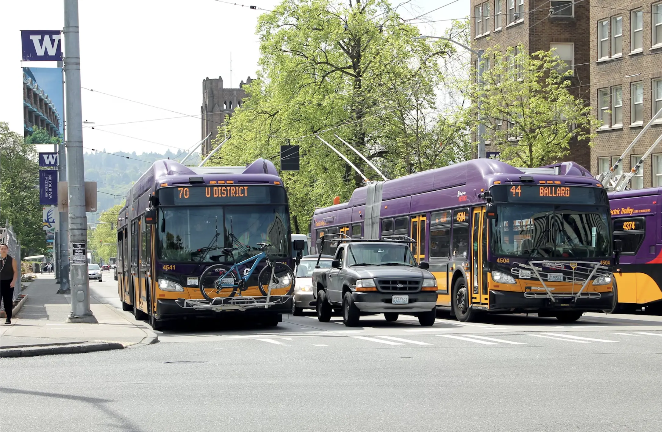 Seattle metro buses driving in the University District.