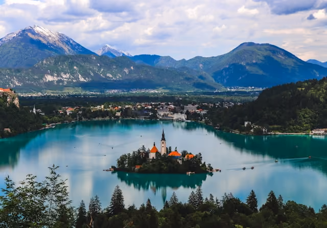 Lake Bled, its island church, and surrounding mountains in Slovenia