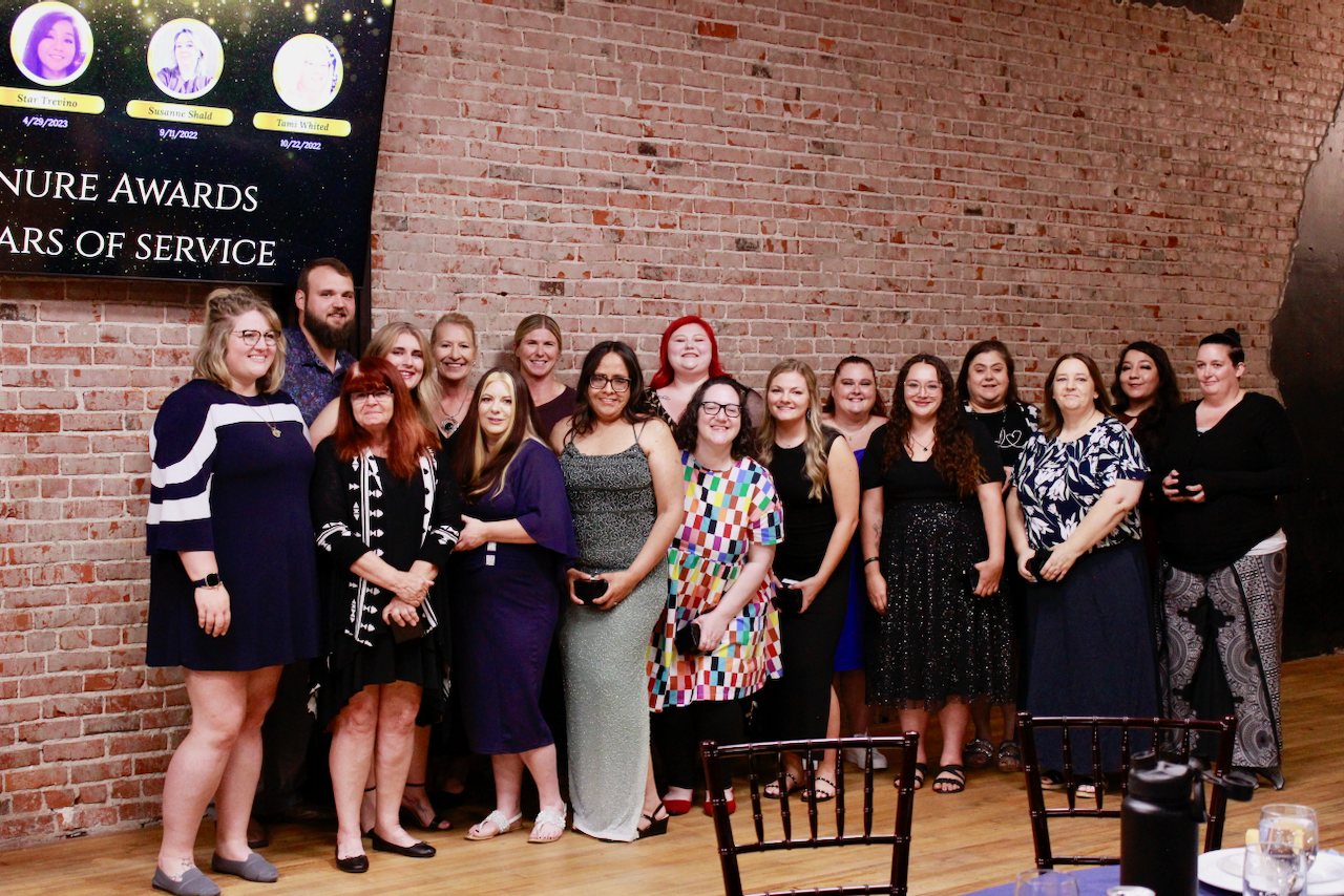 image of parents and staff discussing enrollment