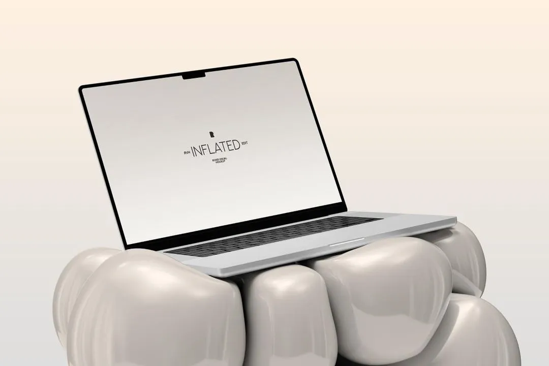 A laptop sitting on top of a group of teeth.
