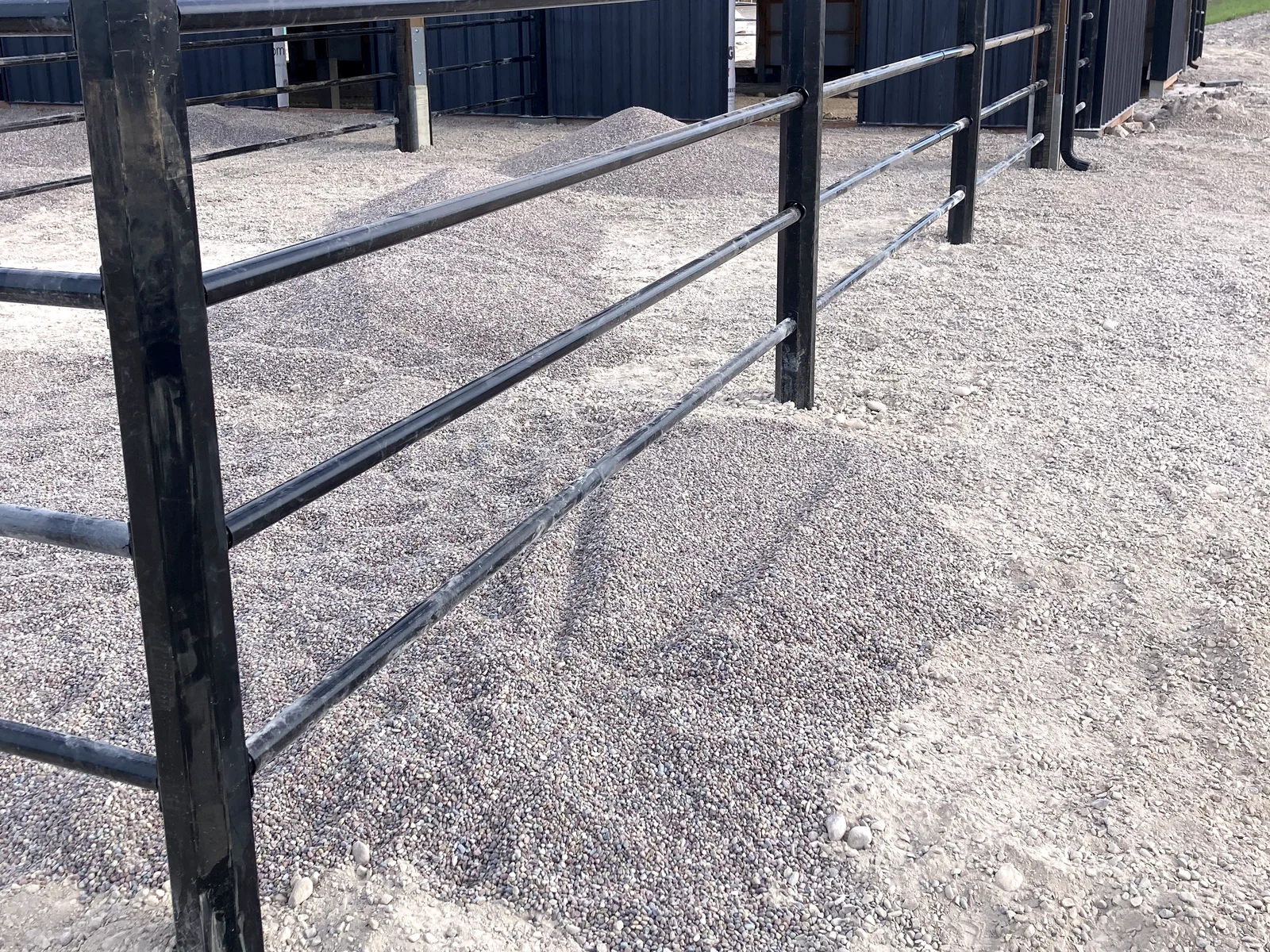 Close perspective along black Priefert Estate Fence rails at the Montana paddocks
