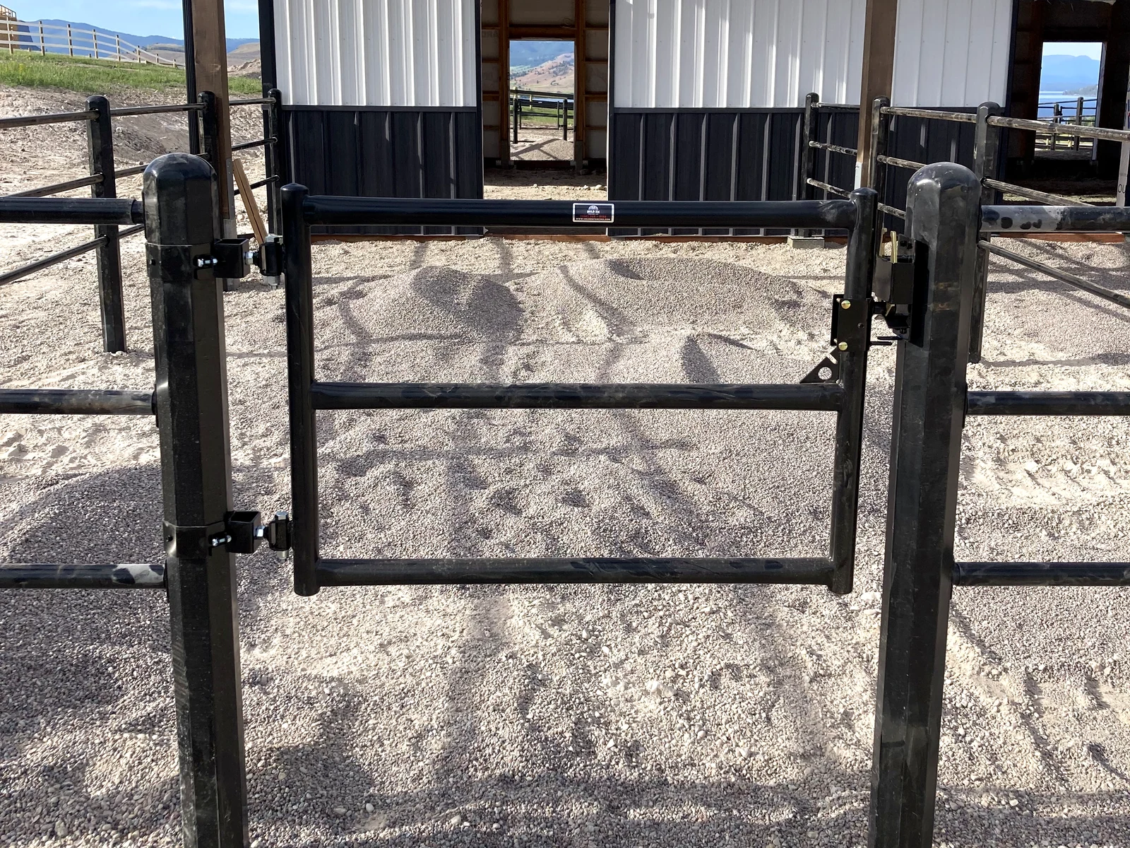 Close view of a black Priefert Estate Fence gate at the Montana barn paddocks