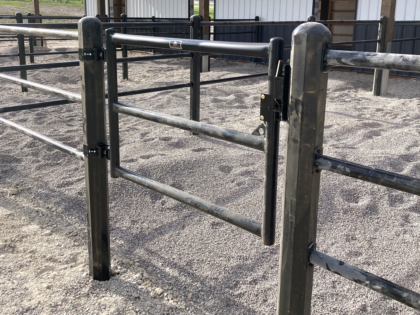 Angled view of a black Priefert Estate Fence gate at the Montana paddocks