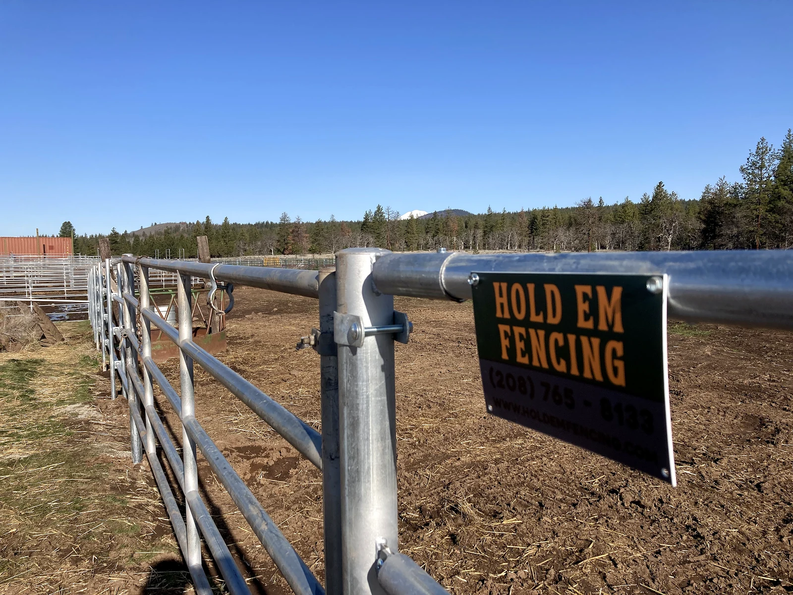 Noble Contour gate detail with a Hold Em Fencing sign at the Goldendale project