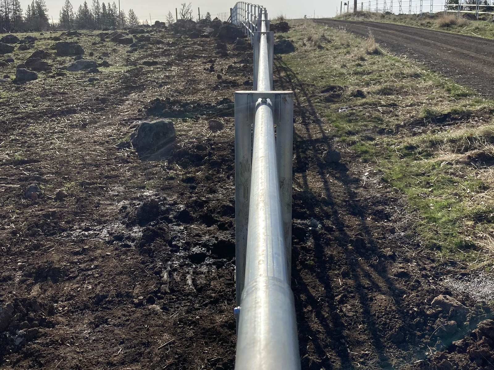 Close perspective along Noble Contour posts and rails beside the driveway
