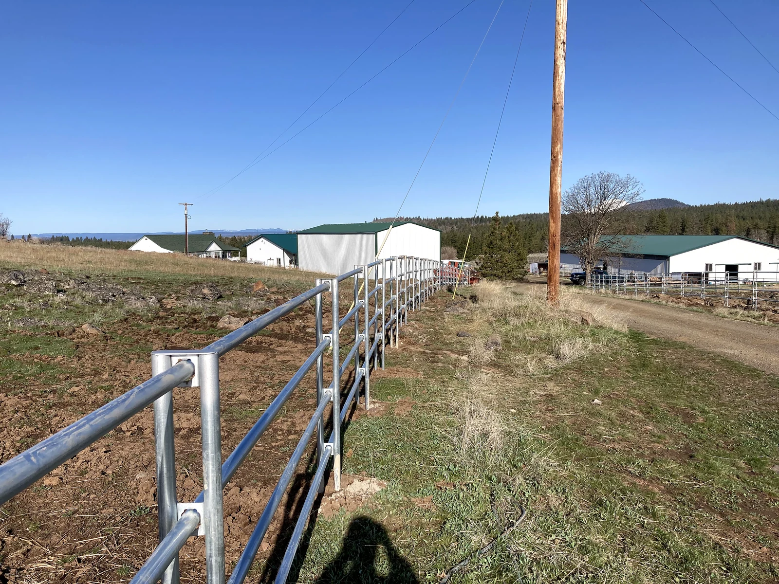 Perspective along a four-rail Noble Contour fence at the Goldendale property
