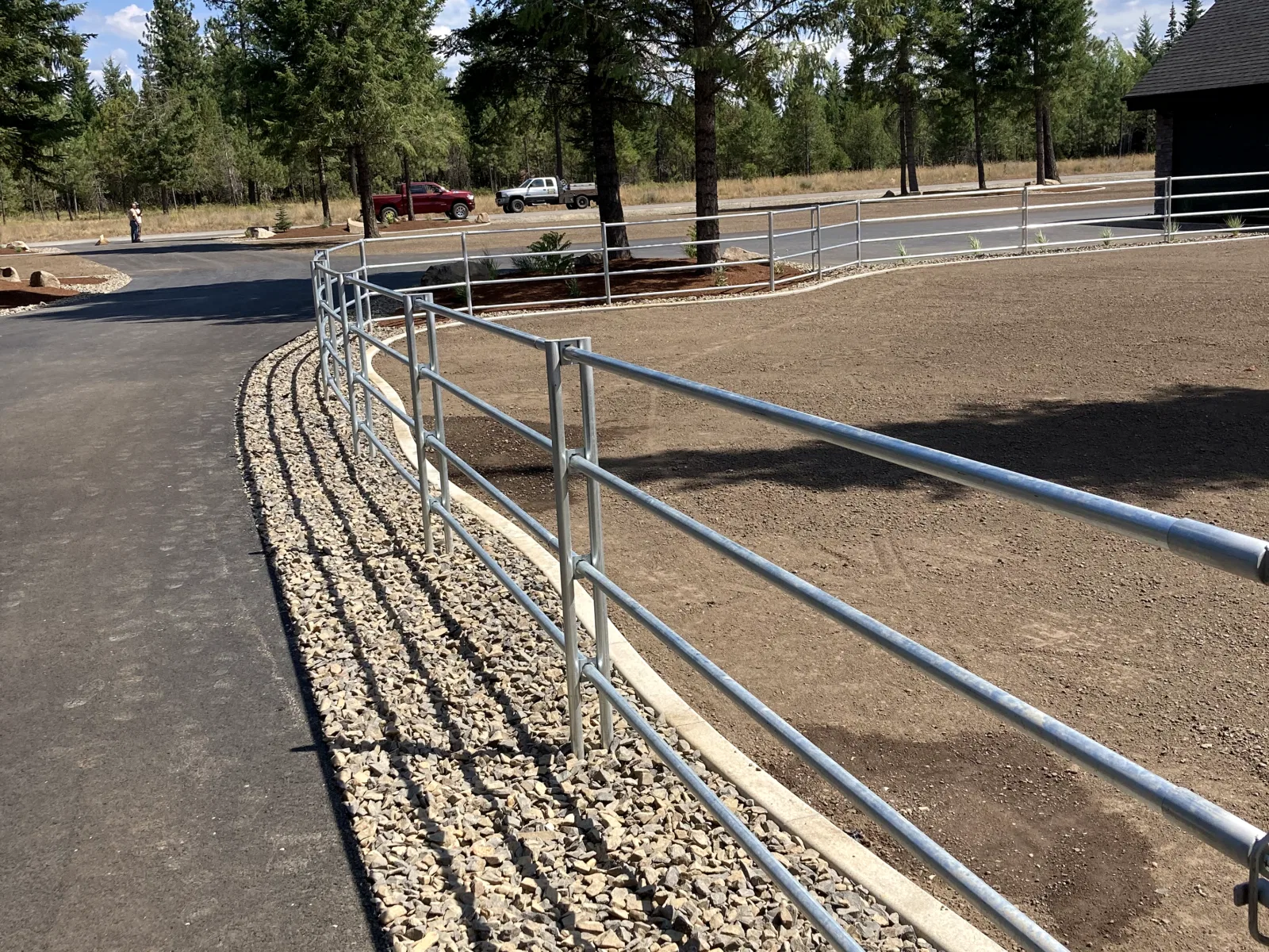 Curved driveway fence at the Hayden, Idaho Dream Ranch project
