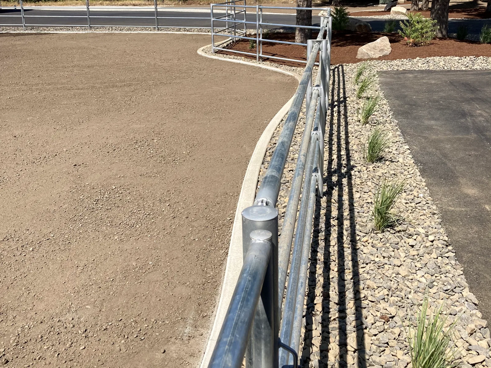 Curved fence long perspective at the Hayden, Idaho Dream Ranch project