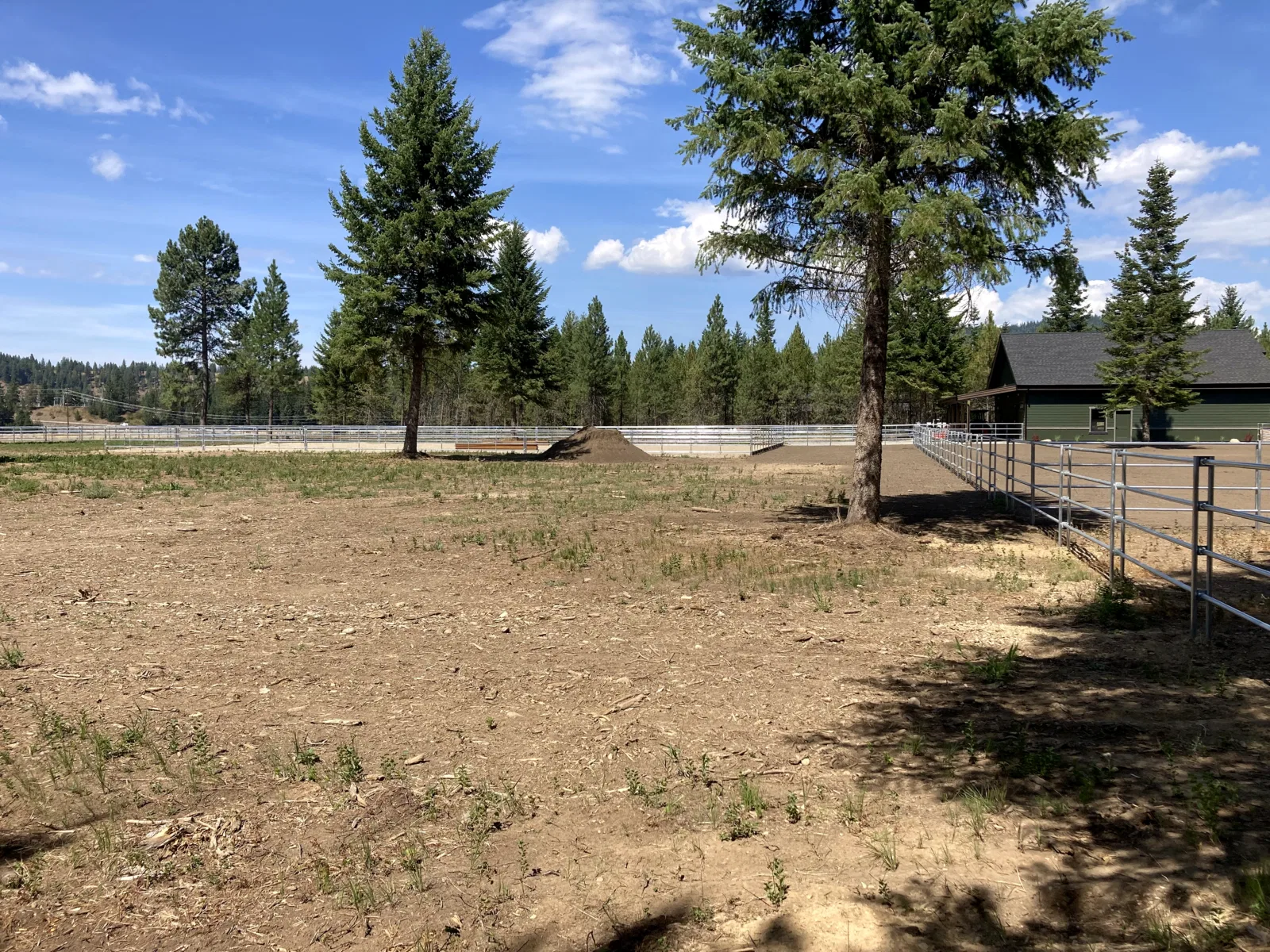 Wide yard and arena at the Hayden, Idaho Dream Ranch project