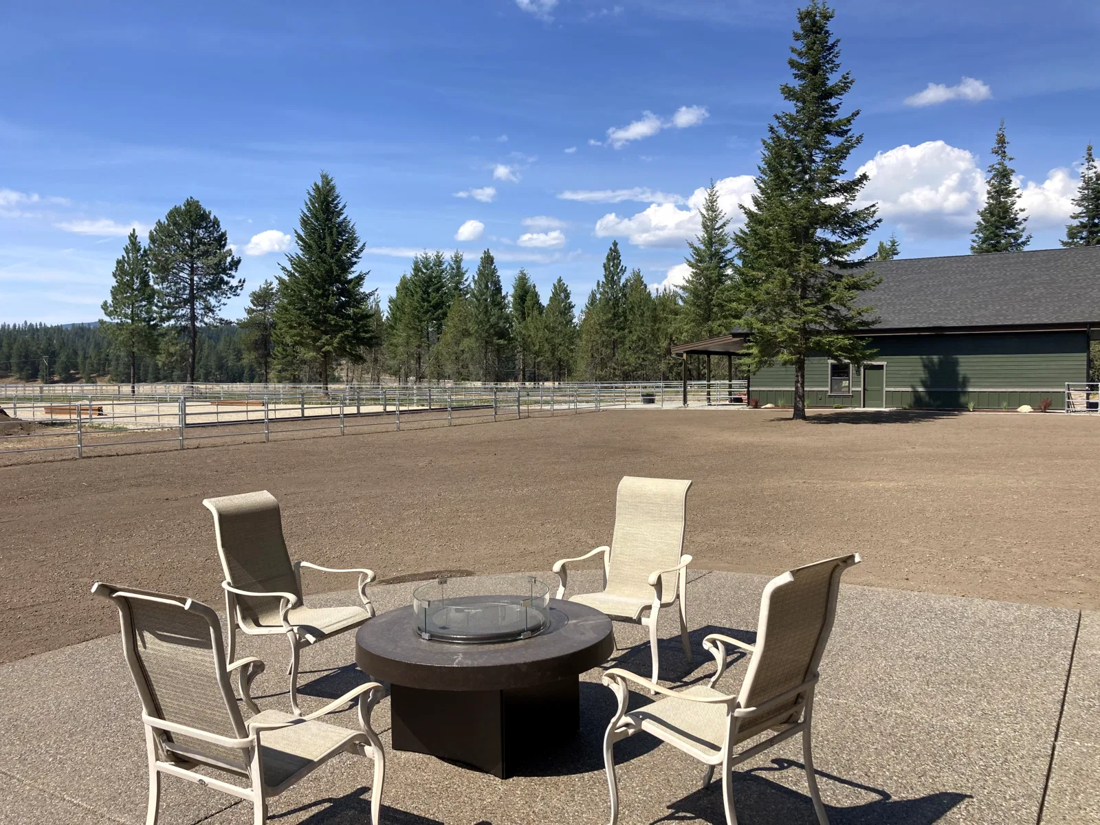 Patio and arena/property overview at the Hayden, Idaho Dream Ranch project