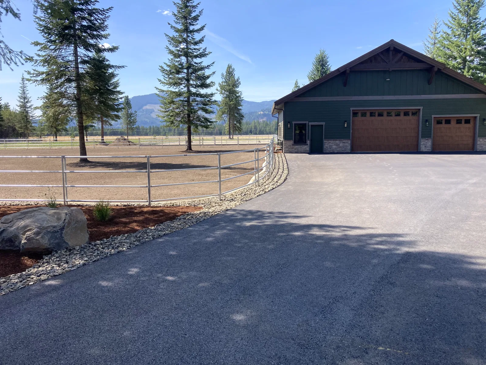 Shop and curved driveway fence at the Hayden, Idaho Dream Ranch project
