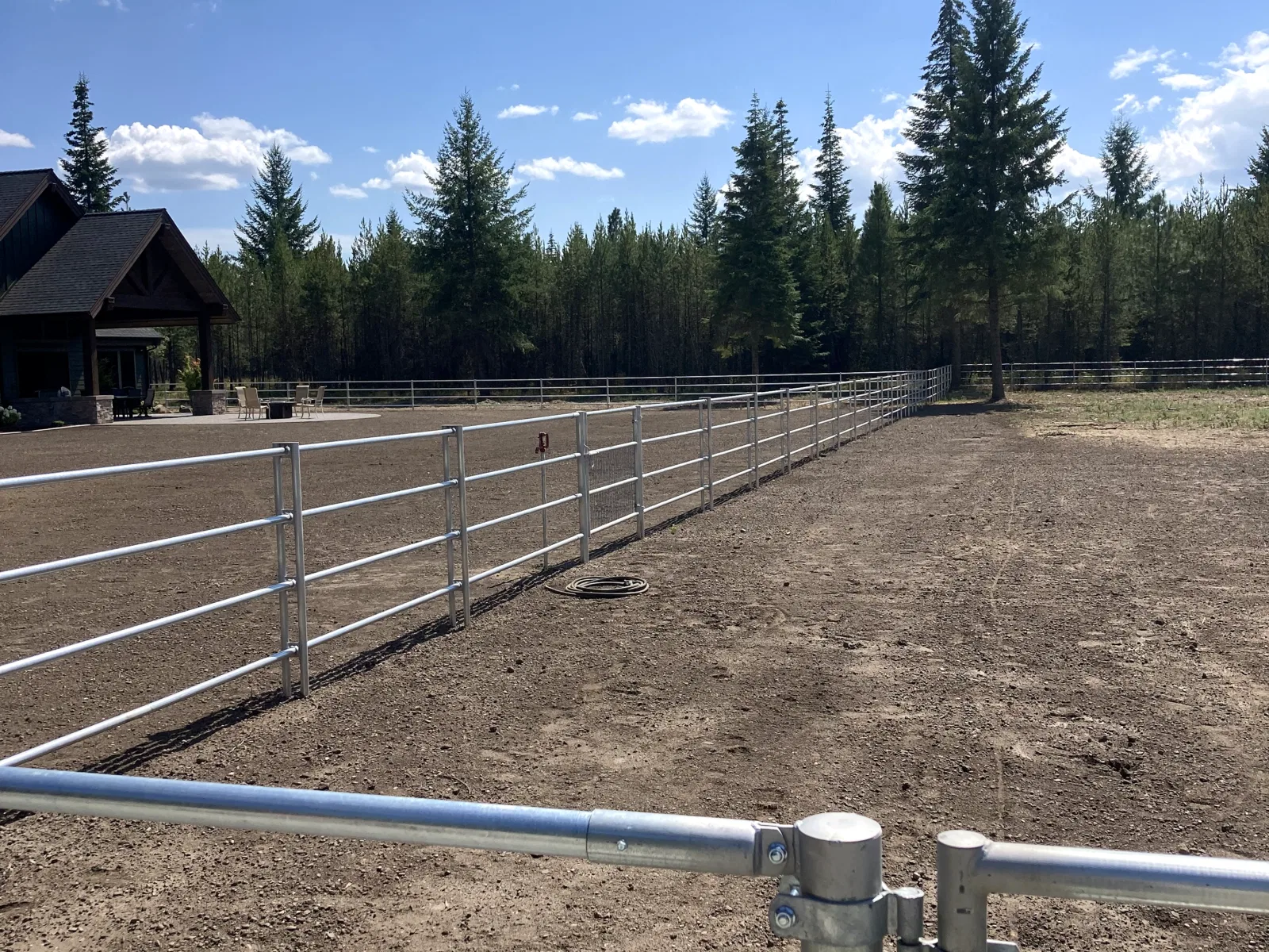 Arena corner toward house at the Hayden, Idaho Dream Ranch project