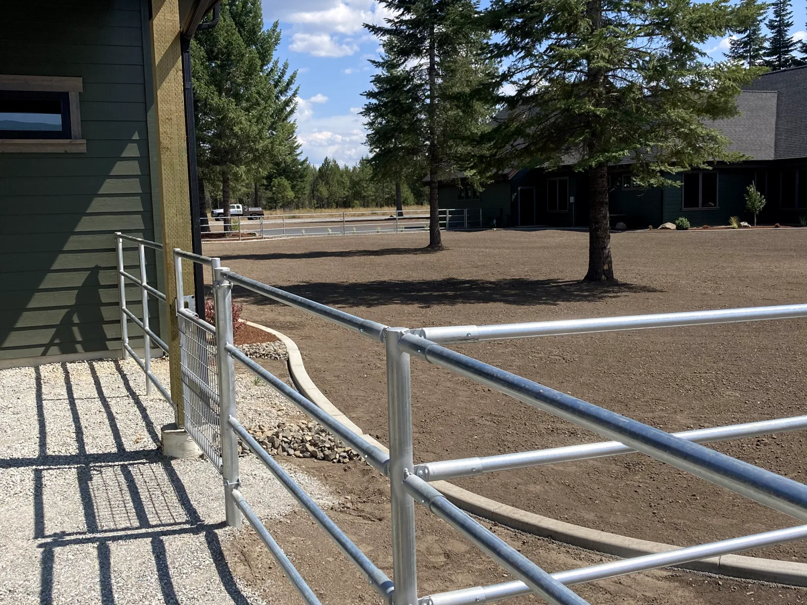 Arena rail near house at the Hayden, Idaho Dream Ranch project