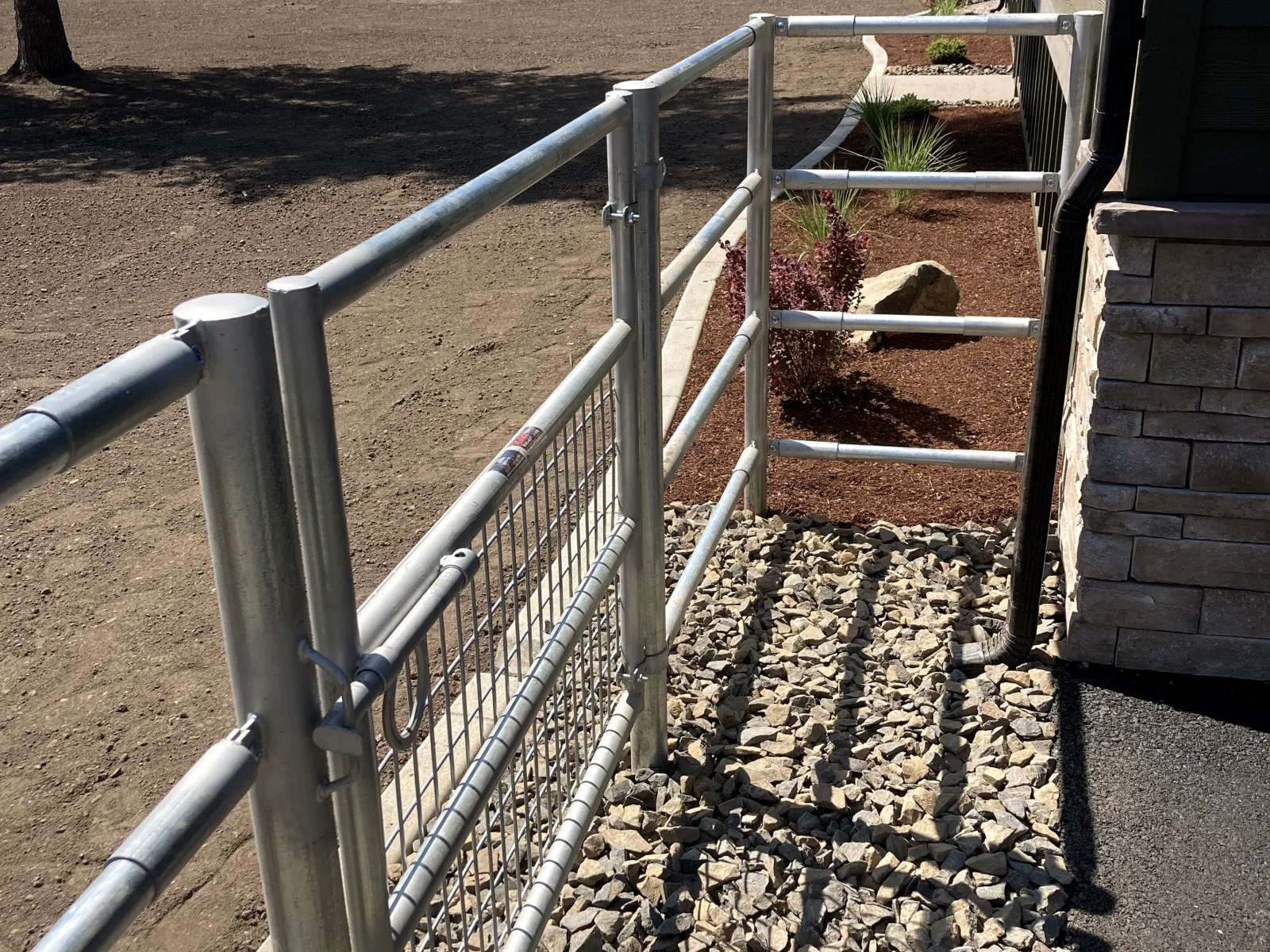 Landscaped mesh gate at the Hayden, Idaho Dream Ranch project