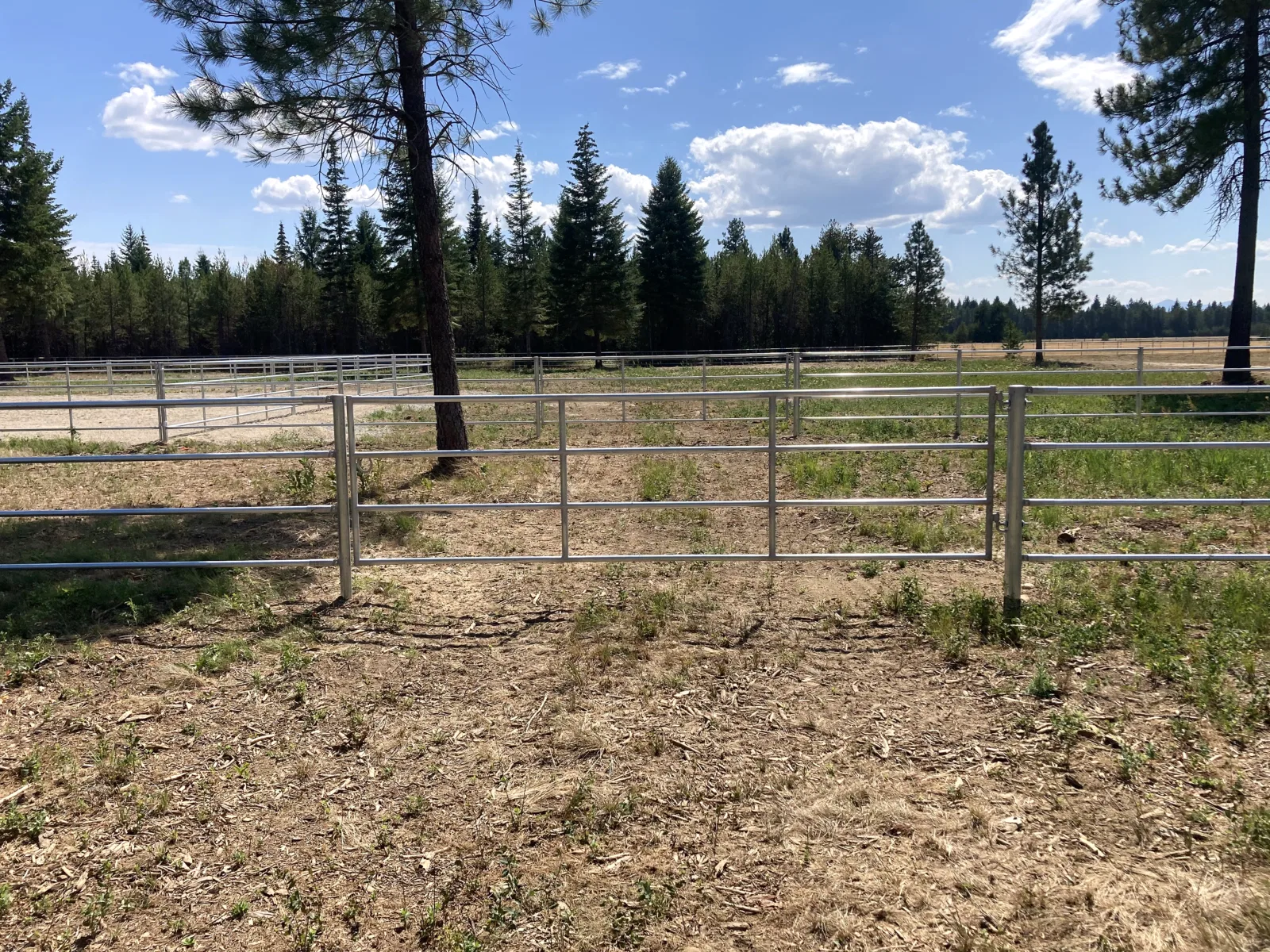 Arena gate and yard at the Hayden, Idaho Dream Ranch project