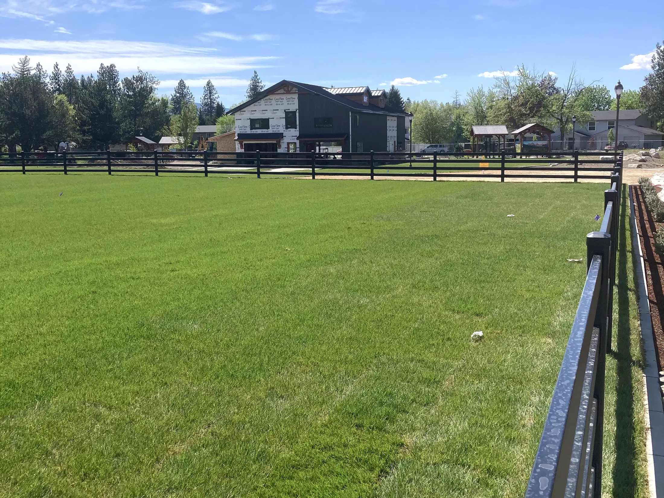 Field-side fence perspective at Faith Walk Community Fitness Park in Coeur d'Alene, Idaho
