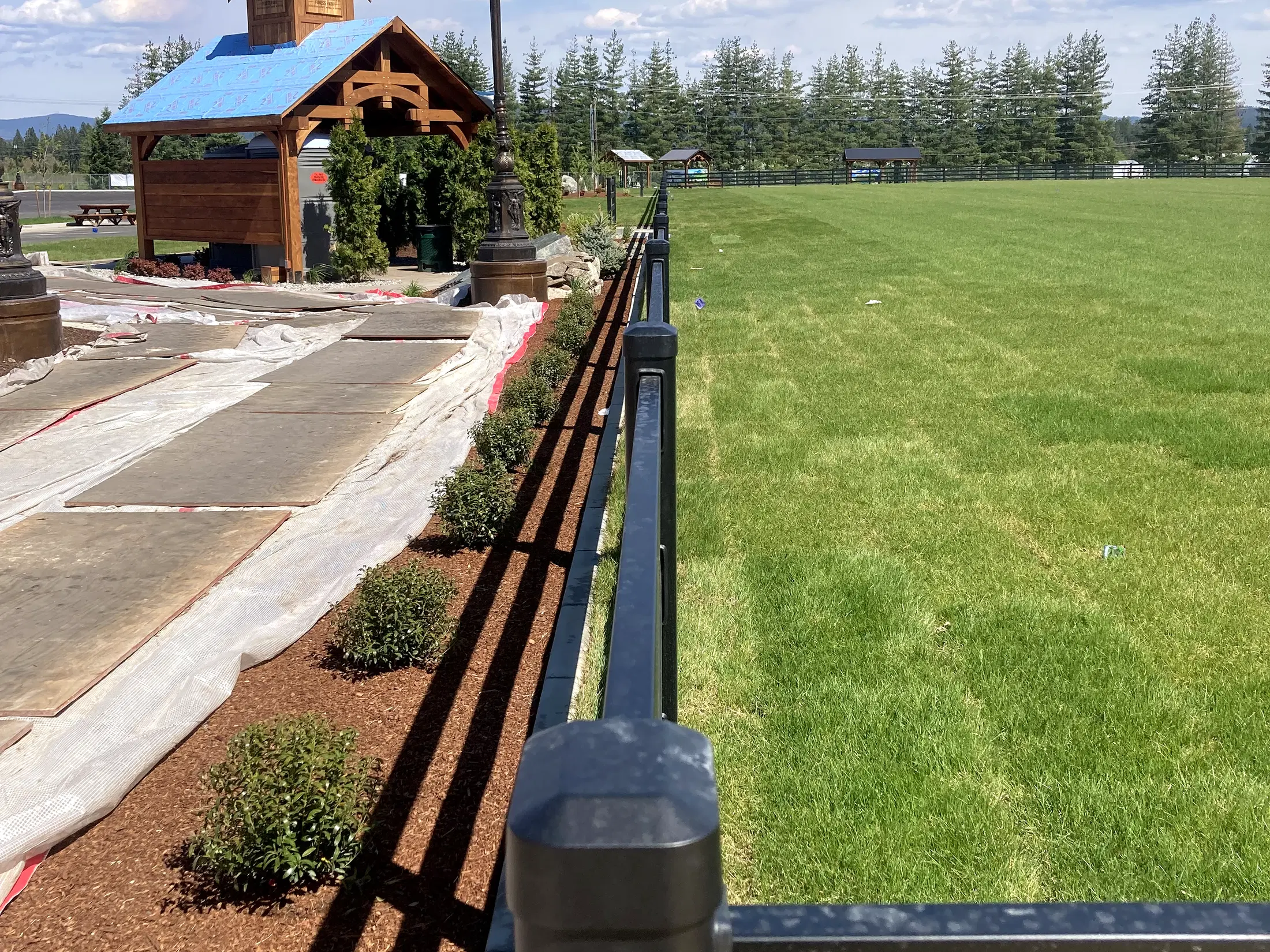 Fence beside gazebo / park building at Faith Walk Community Fitness Park in Coeur d'Alene, Idaho