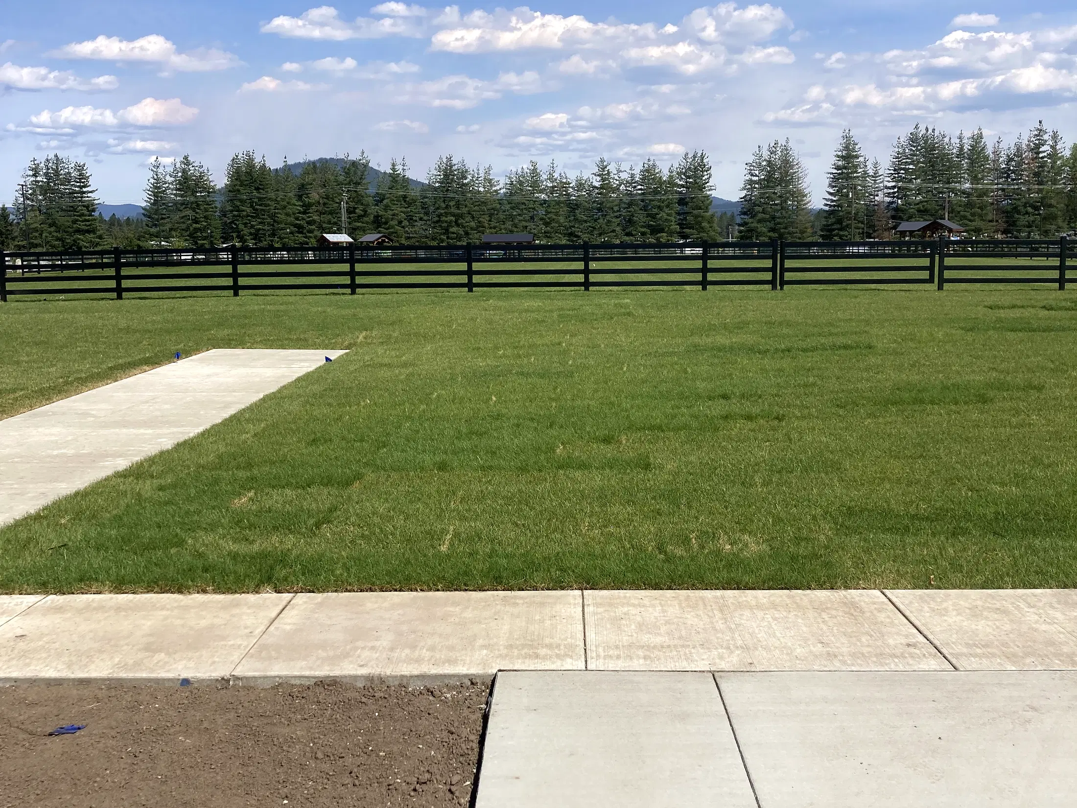 Wide walkway / field view at Faith Walk Community Fitness Park in Coeur d'Alene, Idaho