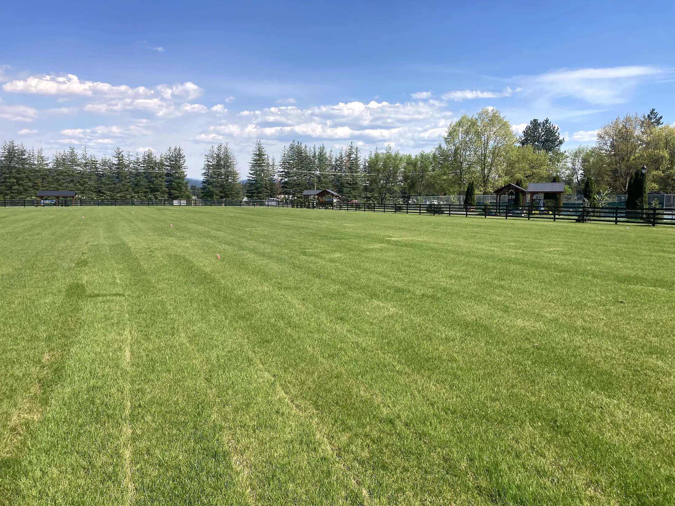 Wide field perimeter view at Faith Walk Community Fitness Park in Coeur d'Alene, Idaho