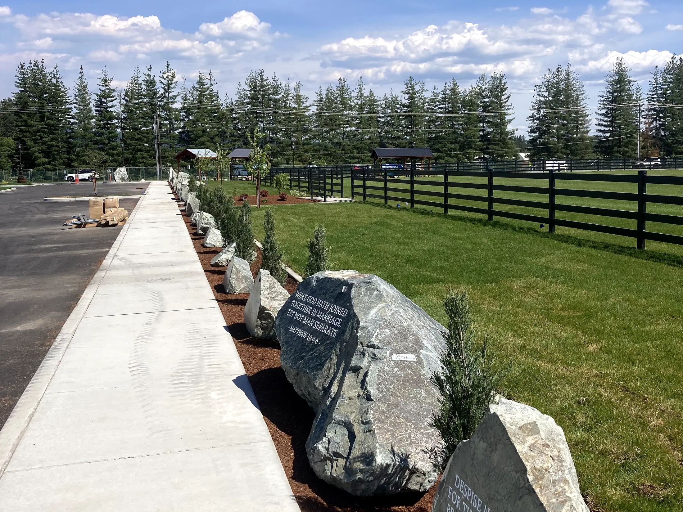 Fence and stone-lined walkway at Faith Walk Community Fitness Park in Coeur d'Alene, Idaho