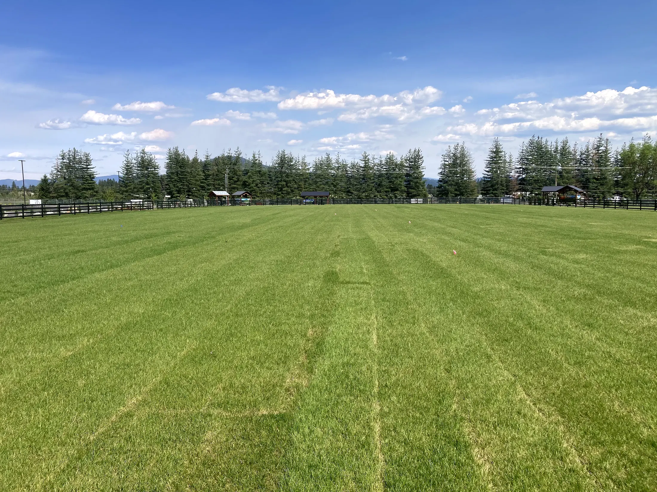 Wide central field view at Faith Walk Community Fitness Park in Coeur d'Alene, Idaho