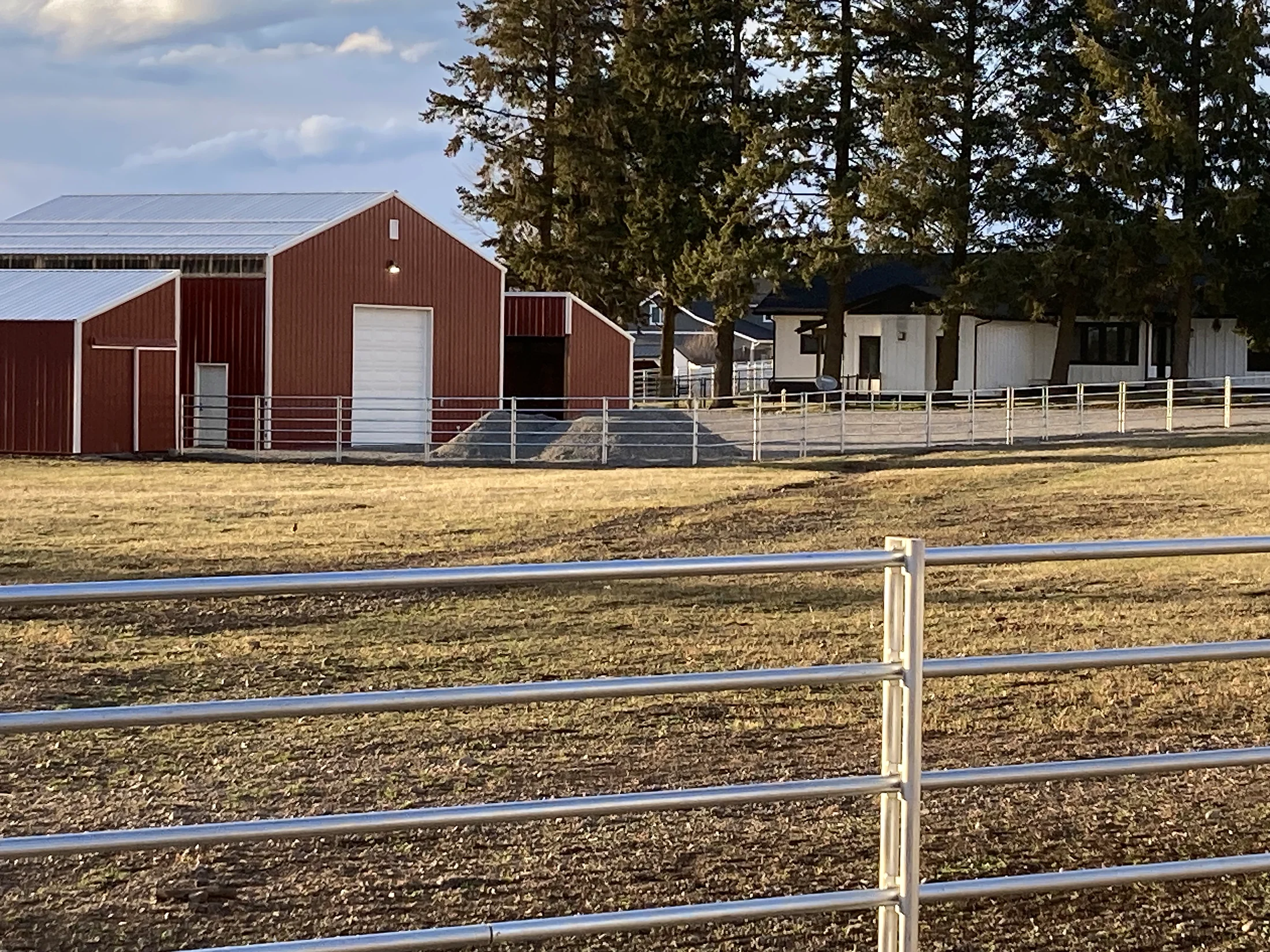 Closer view of Noble Contour fencing near the red barn at the Lacey Avenue project