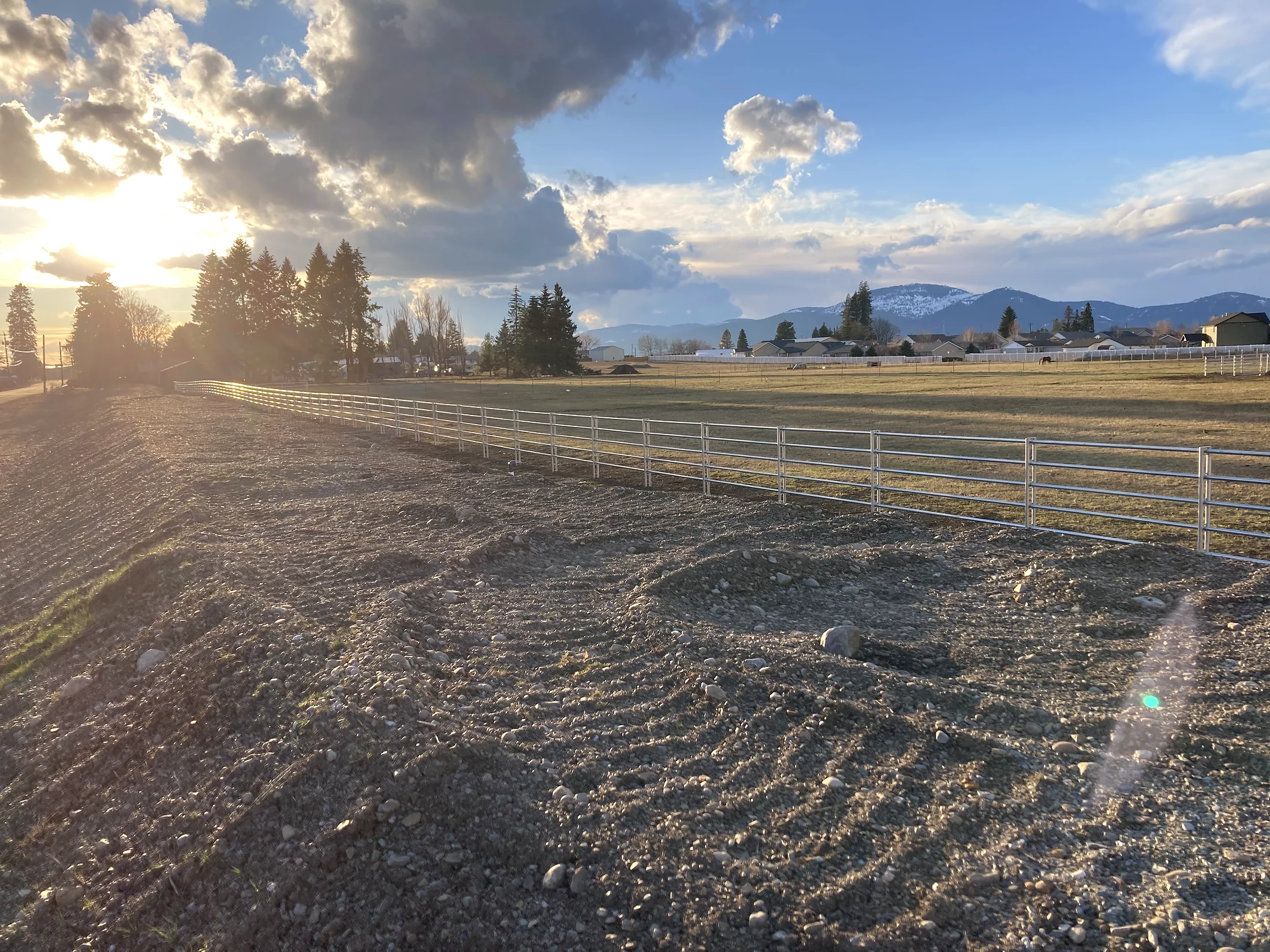 Long Noble Contour fence run under evening light at the Lacey Avenue project in Hayden, Idaho