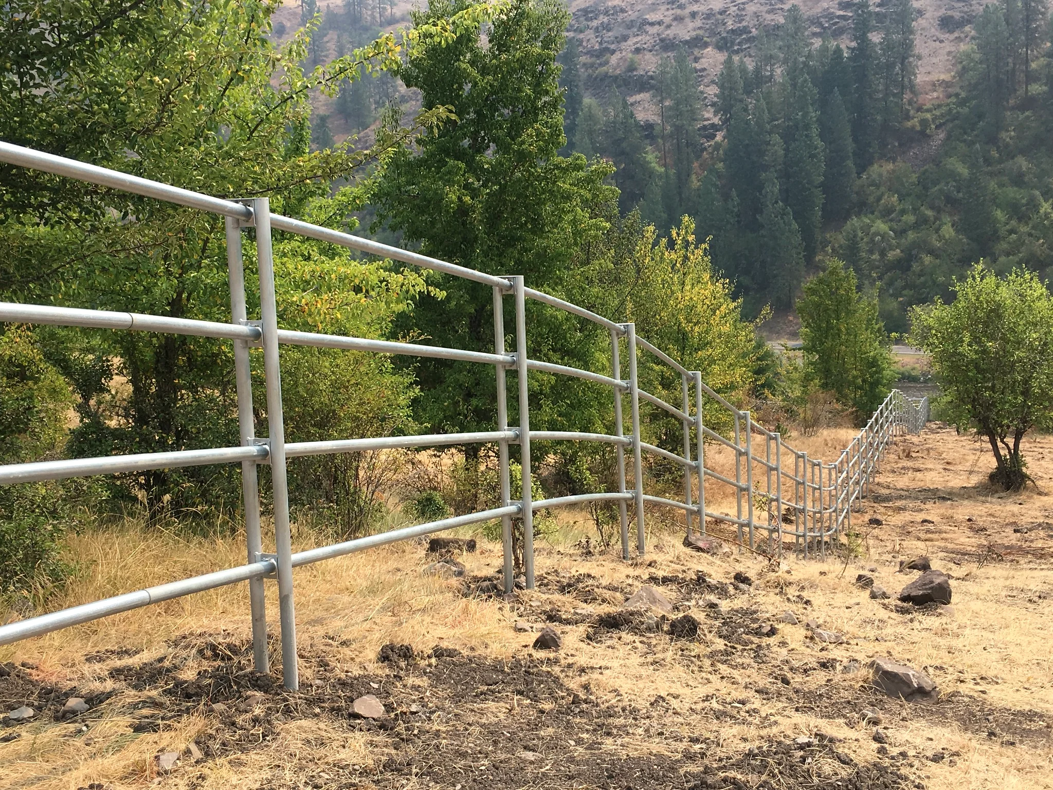 Scenic downhill Noble Contour fence showing the scale and terrain of the Stites-area project