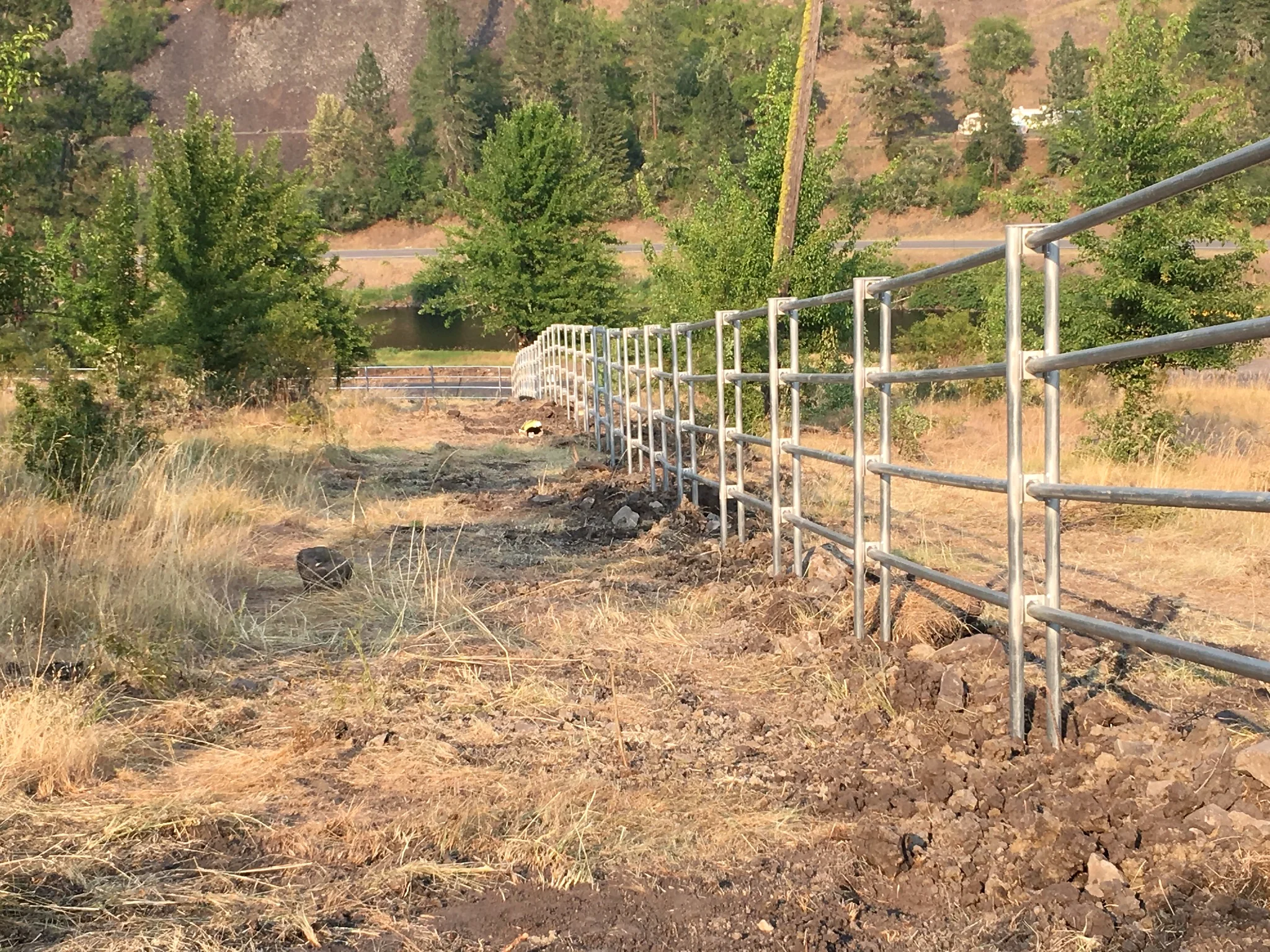 Long Noble Contour fence run descending toward the river valley near Stites, Idaho