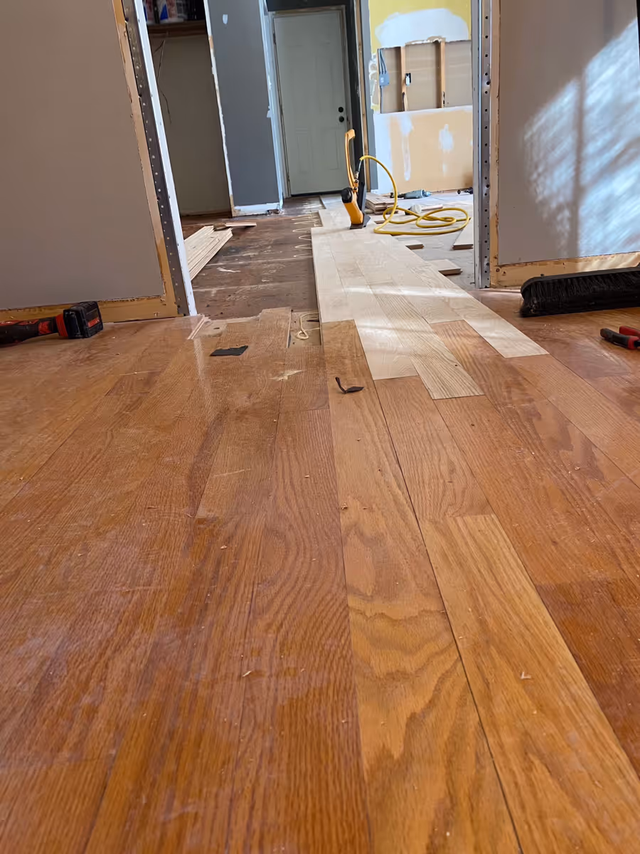 Installation process of adding hardwood through a threshold