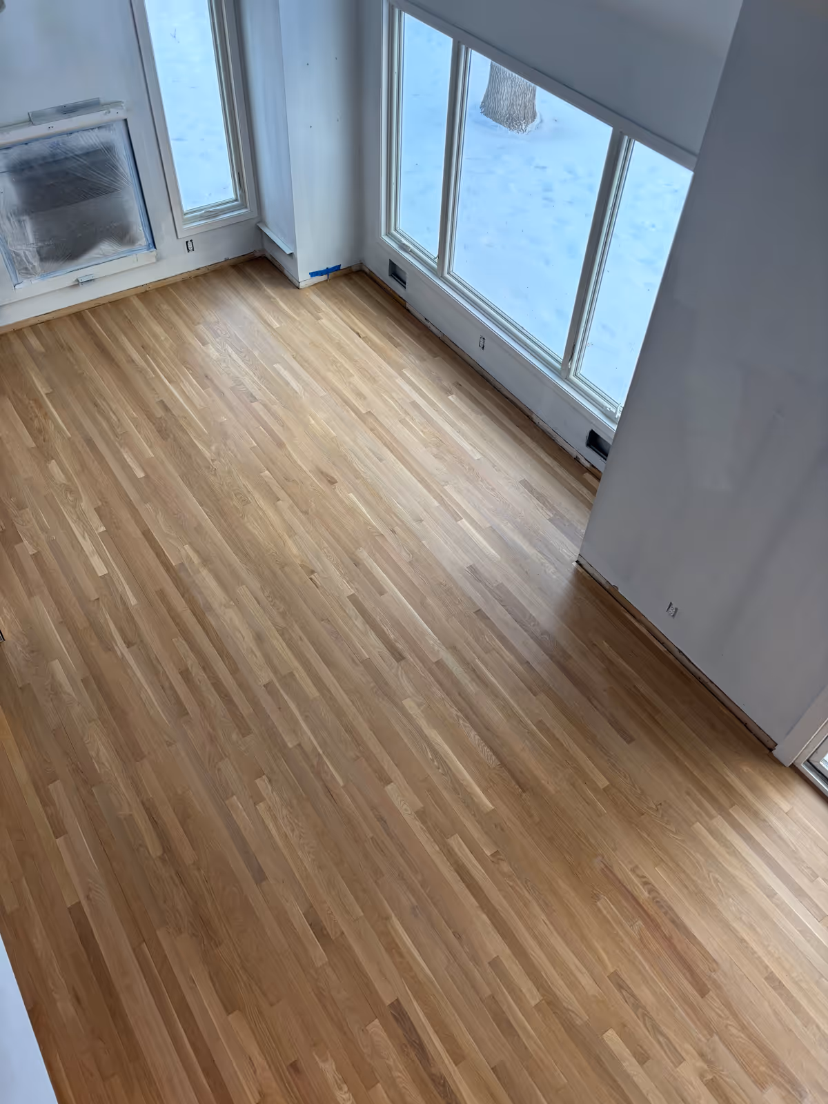 White Oak hardwood floors in Long Lake refinished to a lighter Scandinavian tone