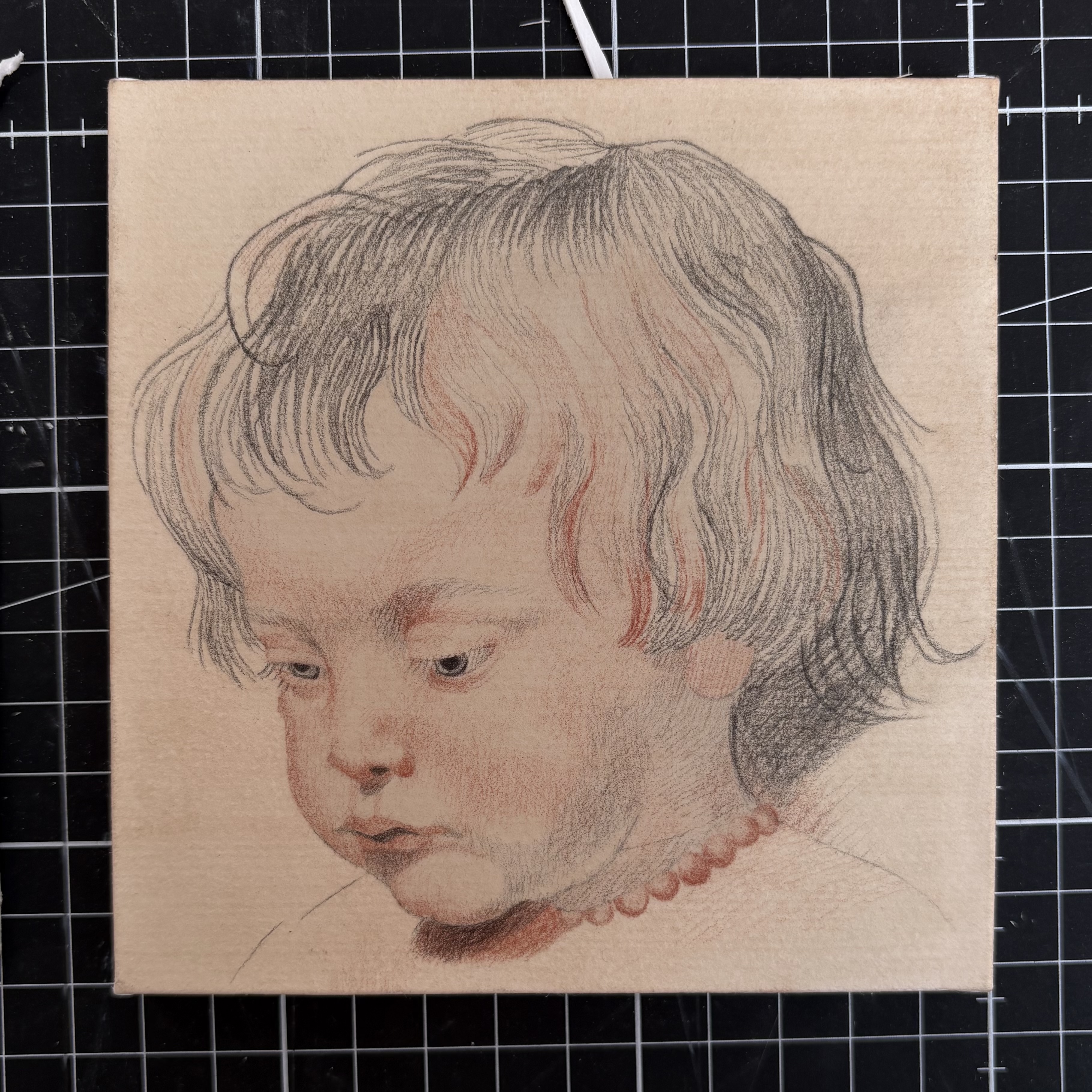 Wooden in post in Venice, Italy with graffiti cat