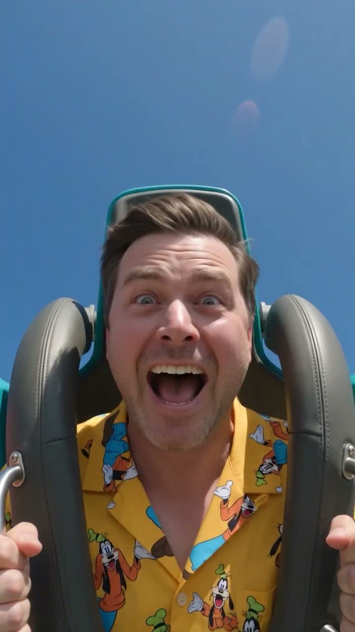 Frame 03, the drop: he shouts wide-eyed on the descent, sun flare in the sky behind him