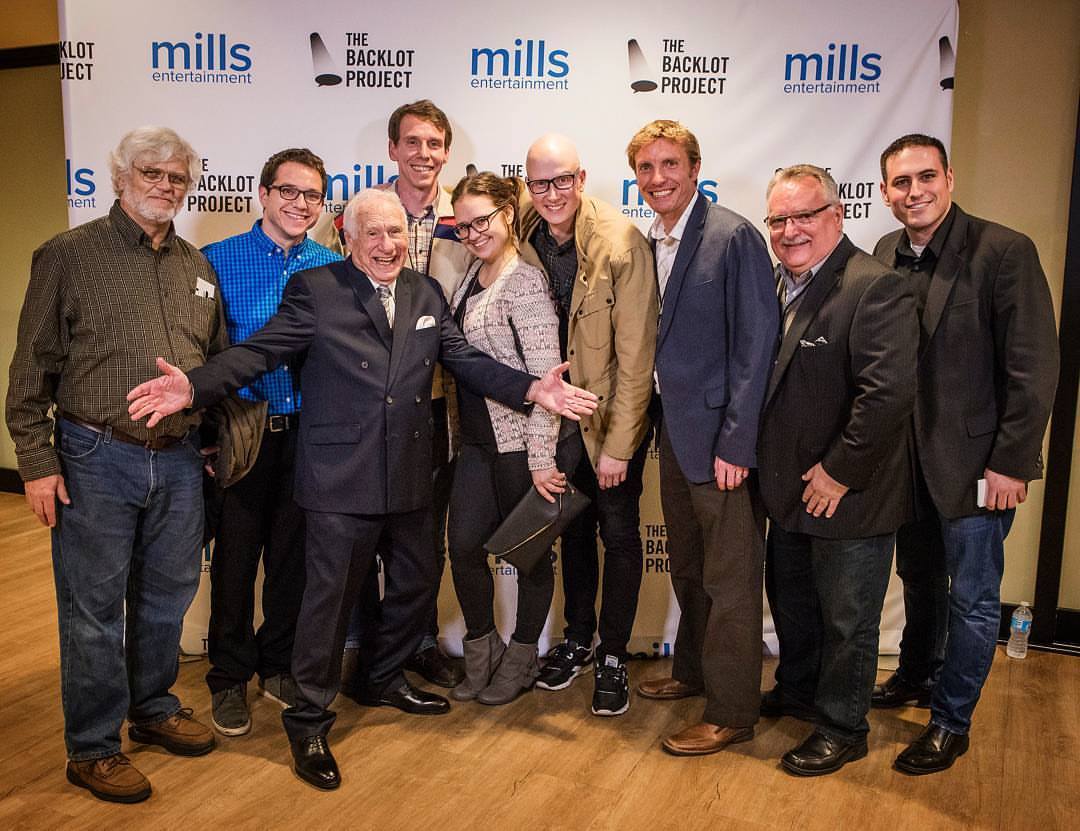 The tour team photographed with Mel Brooks at the Los Angeles event