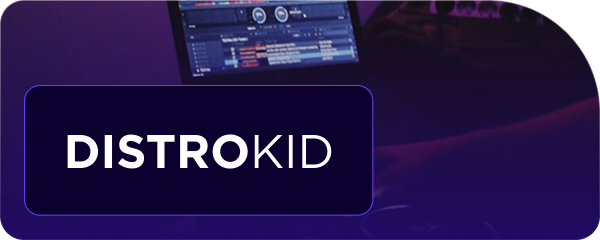 DistroKid logo overlaying a blurred background of a laptop screen and a person's arm.
