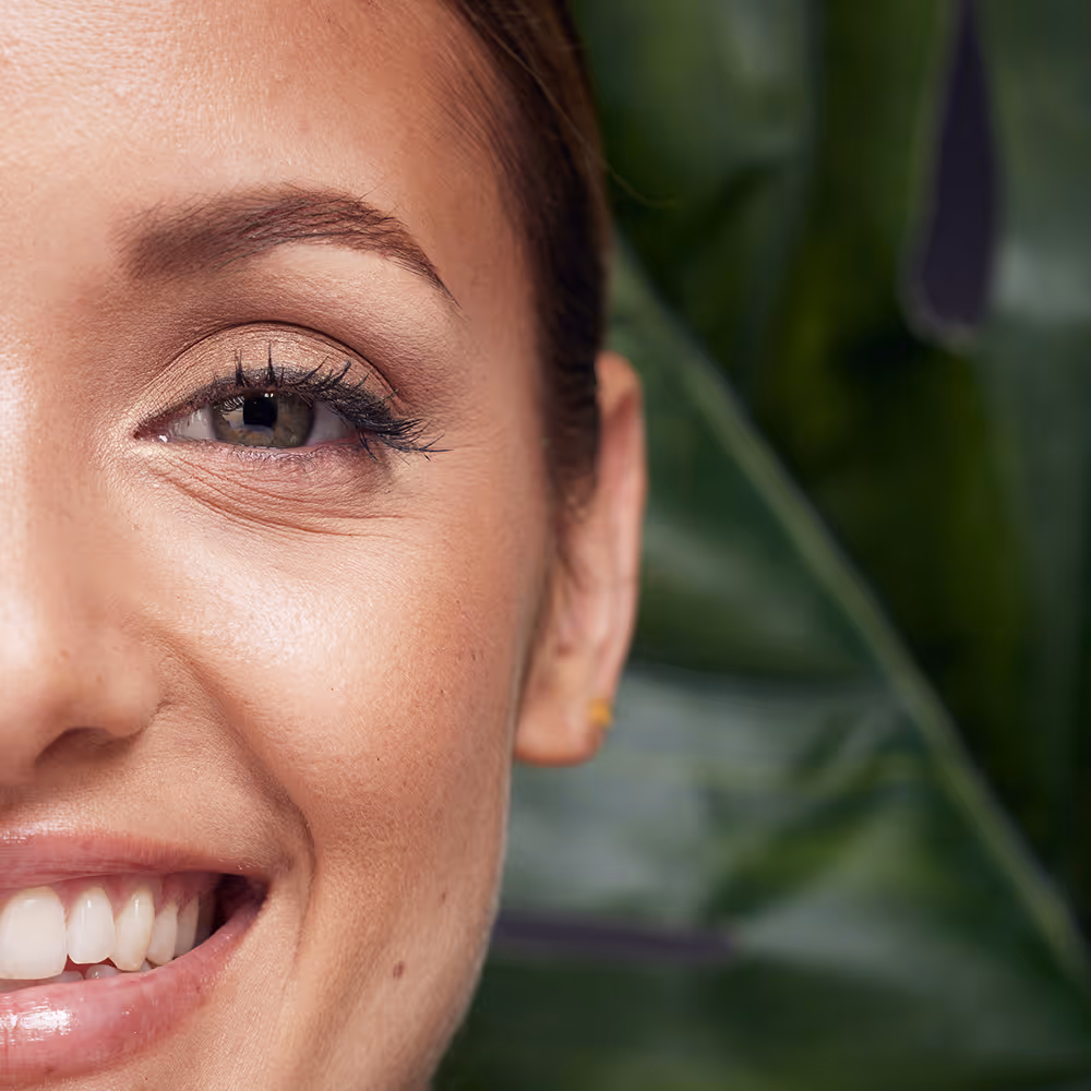 A smiling young woman experiencing emotional relief and healing through virtual EMDR therapy with Ray of Hope Counseling.
