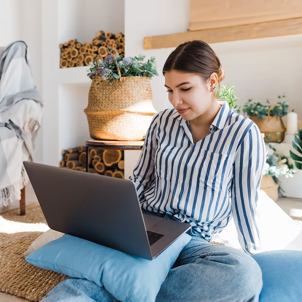 A young woman comfortably engaging in a virtual ERP therapy session from home with Ray of Hope Counseling to manage OCD and intrusive thoughts.