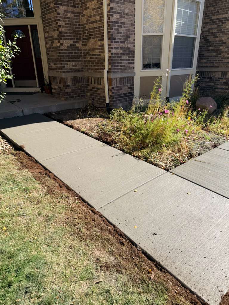 Old cracked concrete driveway before replacement Denver CO