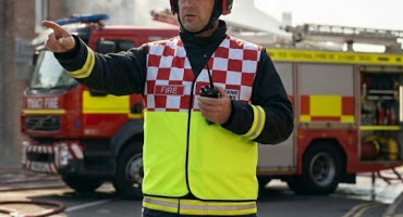 firefighter wearing protec incident command bib