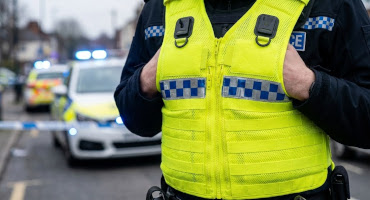 Police officer wearing national framework awarded protec high-vis tactical vest