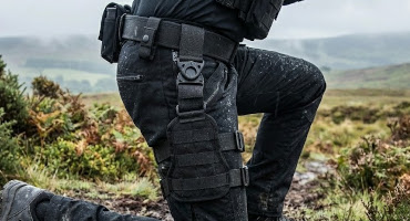 UK firearms officer prone showing protec drop leg MOLLE platform.