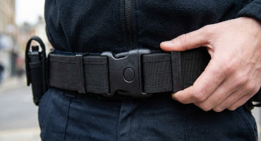 police officer wearing protec nylon duty belt.